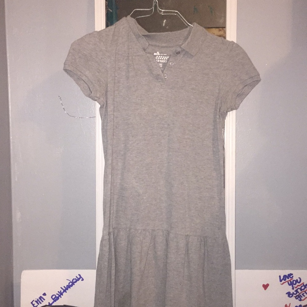 A grey uniform collared dress